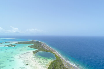 Aerial Landscape Caribbean island with shore coast of various shades of blue in Los Roques, National Park