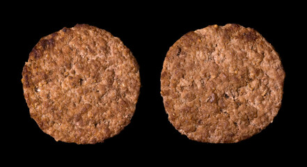 Two burger cutlets isolated on black background