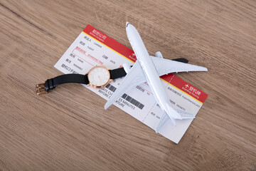 Small aircraft model and plane ticket and watche
