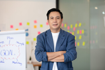 Asian senior business men leader standing smile cross arm and confidence at Co-Working space,Small Business Startup Concept