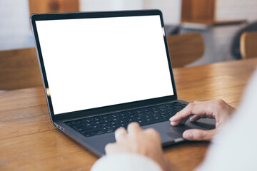 computer mockup blank screen.hand woman work using laptop with white background for advertising,contact business search information on desk at coffee shop.marketing and creative design