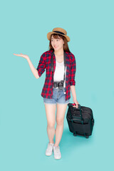 Beautiful young asian woman smiling and travel summer trip with luggage and presenting show something for abroad in vacation, asia girl having camera walking and pull suitcase for journey in holiday.