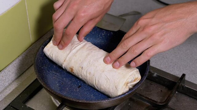 Cooking Meat Shawarma in a Hot Pan Until Crisp. Fry Pita Bread in Kitchen.