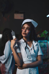 Horror scary evil insane nurse doctor held the knife, Zombie woman gosth with halloween concept