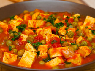 Vegan tofu and green peas curry
