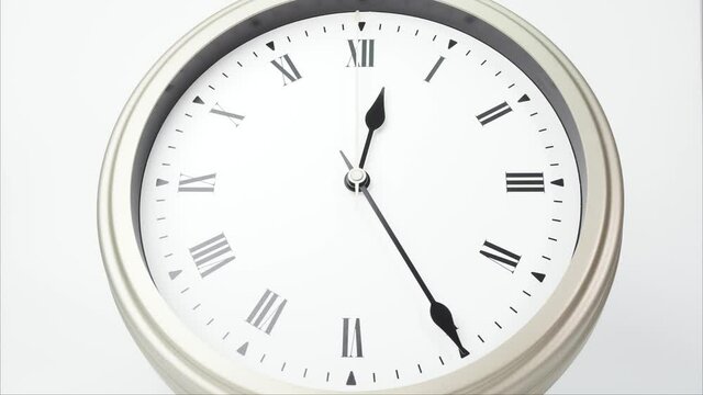Eat lunch Close up Twelve o'clock White clock, Time lapse 60 minutes moving fast.