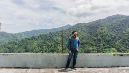 Fototapeta na wymiar Man enjoying mountain view in San Juancito Fracismo Morazan Honduras Central America