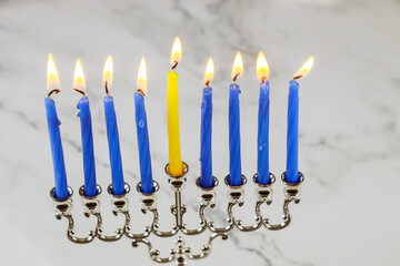 Lighting candles in menorah for Hanukkah