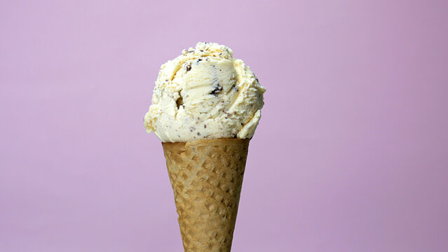 Ice cream flavor Chocolate Chip scoop in waffle cone, Closeup Front view Food concept.