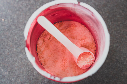 Open Jar Of Protein Powder Supplement Shot From Top Down Perspective