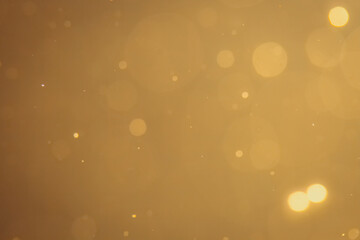 Dark Abstract Gold bokeh sparkle on black background