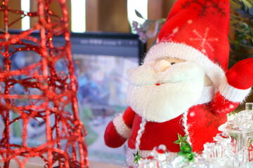 Fototapeta premium Close up santa claus fabric doll on Christmas environment background, have copy space for put text.