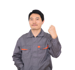 Young worker making a fist and raising his hand to cheer himself up in front of white background