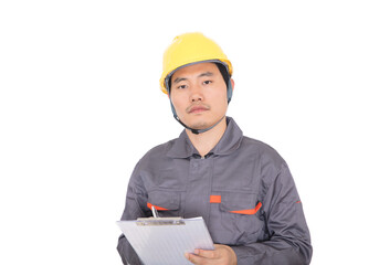 Worker wearing yellow hard hat in front of white background holds folder