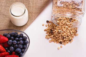 Top view of a bowl of berries, yogurt and granola