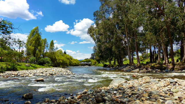 View at confluence of two mountain rivers Tomebamba and Yanuncay at the valley of Cuenca city, Ecuador