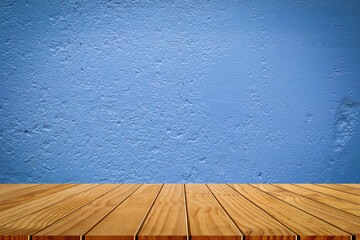 Wooden tabletop template mockup for display merchandise. wooden shelf table isolated on blue wall...