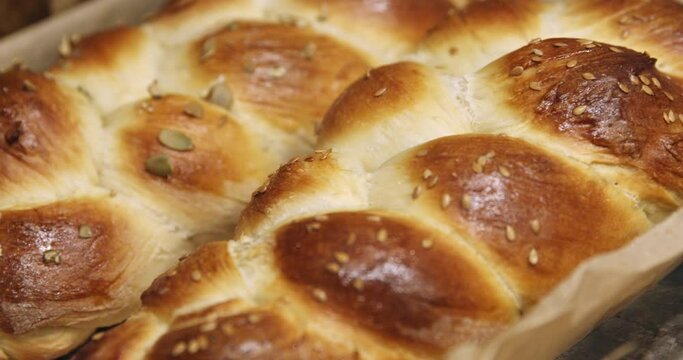 Close up of freshly baked challah just pulled out of the oven.
