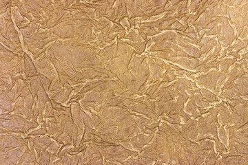 crinkled and creased handmade brown paper texture. grungy paper background