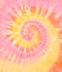 Spiral tie dye background. Swirl tie-dye pattern. Hippie boho circular tiedye wallpaper in orange yellow. - 381540432