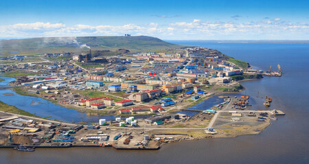 Fototapeta na wymiar Summer aerial view of the city of Anadyr. Top view of the northern port town. Anadyr is the administrative center of the Chukotka Autonomous Region of the Russian Federation. Far East Russia, Arctic.