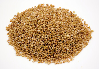 Close-up of kodo millet grains on a  white background