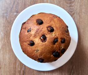 Top view of Christmas Chocolate Cake Panettone On Wooden Background