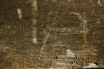 Wooden plank left outside heavy weathered silver grey brown tones - closeup overlay. Fence board, lumber, timber, rouh sawn, background, surface, barnwood