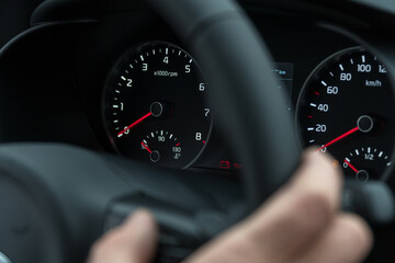 Speedometer in the car on the dashboard at night. Selective focus