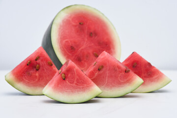 Food art with fresh red ripe watermelon for making drink / juice, slices of kiran India. Healthy...
