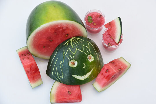 Food art with fresh red ripe watermelon for making drink / juice, slices of kiran India. Healthy refreshing  drink for hot Indian summer. Reduce the body heat, cool drinks