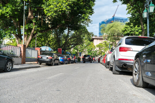 Parallel parking cars on urban street. Outdoor parking on road