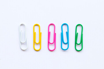 background texture colorful paperclip arrangement flat lay style on white 