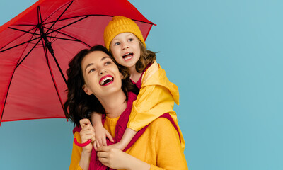 Family with red umbrella