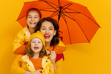 Family with red umbrella