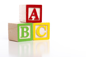 Wooden ABC blocks on white background