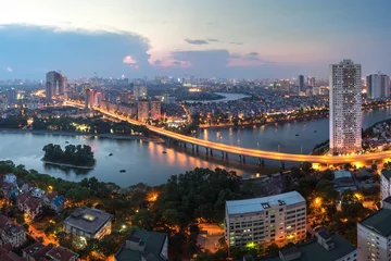 Deurstickers Aerial skyline view of Hanoi at Linh Dam lake, Belt Road No. 3. Hanoi cityscape by sunset period © Hanoi Photography