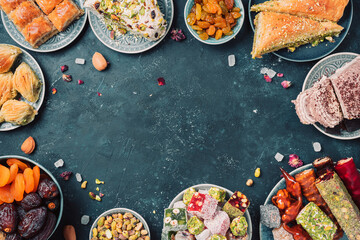 Traditional turkish delight on dark background. Top view. Flat lay. Copy space. Arab dessert,...