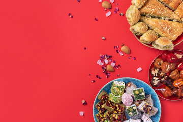 Baklava, halva, rahat lokum, sherbet, nuts, pistachios, dates, raisins, dried apricots, churchkhela. Assorted traditional eastern desserts, arabian sweets, turkish delight. Top view. Flat lay