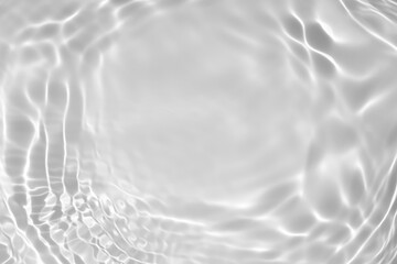 Fototapeta na wymiar de-focused. Blurred desaturated transparent clear calm water surface texture with splashes and bubbles. Trendy abstract nature background. White-grey water waves in sunlight. Copy space.