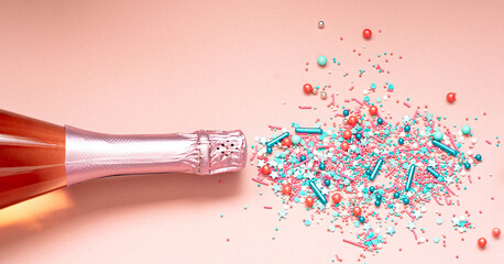 Champagne explosion. Bottle cork. Sweet splashes. Romantic holiday party concept. Flat lay, top view. Space for text. Pink