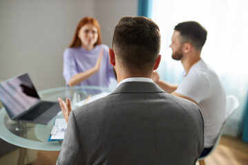 even professional psychologist is powerless to solve family problems, young caucasian couple is arguing in the presence of psychologist, listening them, ready to help