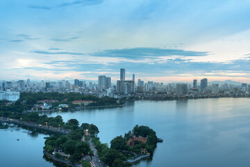 Fototapeta premium Aerial view of Hanoi skyline at West Lake or Ho Tay. Hanoi cityscape at twilight