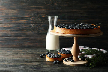 Concept of tasty lunch with blueberry pie on wooden background