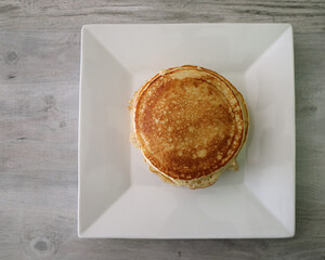 Top view of pancakes on a plate.