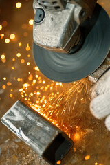 Processing and grinding of a metal part using an angle grinder.