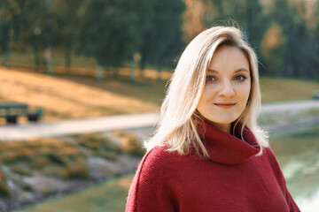 Naklejka premium portrait of young blonde woman in autumn