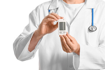 Doctor with digital glucometer on white background. Diabetes concept