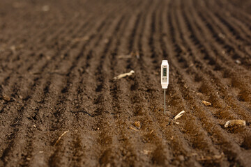 Soil temperature sensors that measure soil temperature at the field
