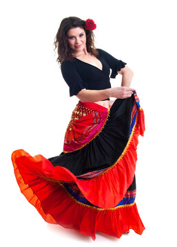 Beautiful young female flamenco dancer in traditional vivid Spanish dress in various poses